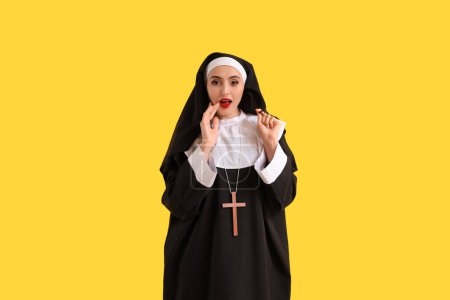 Naughty nun on yellow background