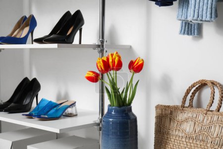 Photo for High heels and tulips in modern woman's wardrobe - Royalty Free Image