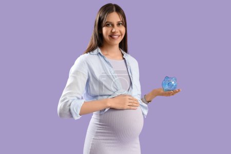 Young pregnant woman with piggy bank on lilac background. Maternal Benefit concept