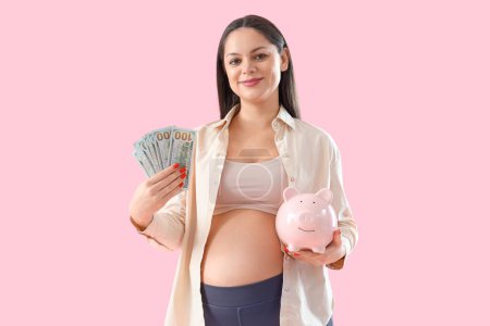 Young pregnant woman with money and piggy bank on pink background. Maternity Benefit concept