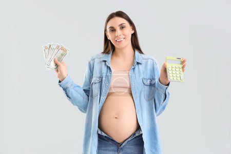 Young pregnant woman with calculator and money on light background. Maternity Benefit concept