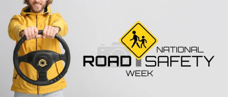 Man with steering wheel on light background. Banner for National Road Safety Week