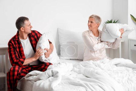 Mature couple quarreling in bedroom
