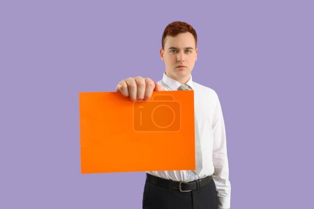 Photo for Business man holding blank paper on lilac background. Harassment concept - Royalty Free Image