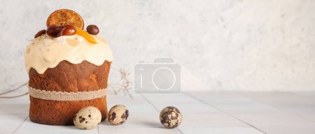 Photo for Easter cake and quail eggs on light background with space for text - Royalty Free Image