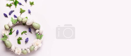 Photo for Easter wreath and flowers on white background with space for text - Royalty Free Image
