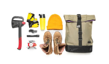 Photo for Set of hiking essentials with backpack, boots and outdoor gear on white background - Royalty Free Image