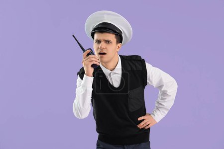 Photo for Young sailor with radio transmitter on lilac background - Royalty Free Image