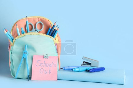 Paper with text SCHOOL'S OUT, backpack and different stationery on blue background
