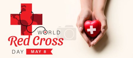 Hands with heart on light background, top view. Banner for World Red Cross Day