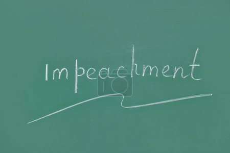 Word IMPEACHMENT written on chalkboard
