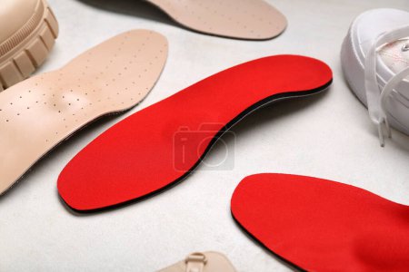 Photo for Shoes and orthopedic insoles on white background - Royalty Free Image