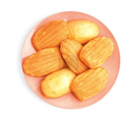 Pink plate with tasty Madeleine cookies on white background