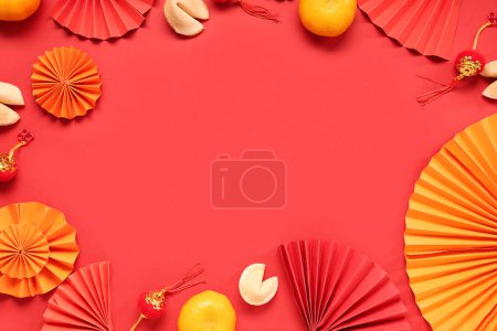 Photo for Frame made of fortune cookies with mandarins and Chinese symbols on red background. New Year celebration - Royalty Free Image