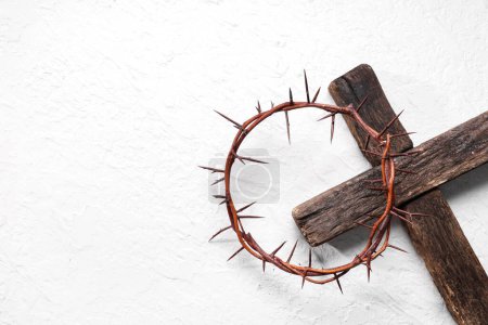 Photo for Crown of thorns with wooden cross on white grunge background. Good Friday concept - Royalty Free Image