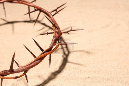 Photo for Crown of thorns on sand background, closeup. Good Friday concept - Royalty Free Image