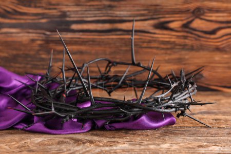 Photo for Crown of thorns with purple cloth on wooden background, closeup. Good Friday concept - Royalty Free Image