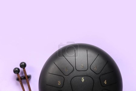 Glucophone with sticks on purple background