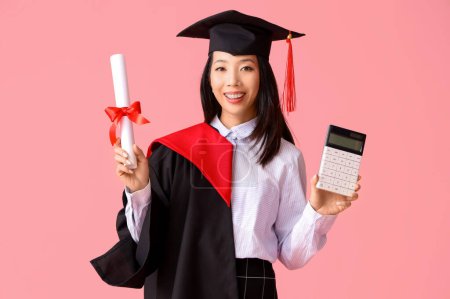 Photo for Asian female graduate student with diploma and calculator on pink background - Royalty Free Image