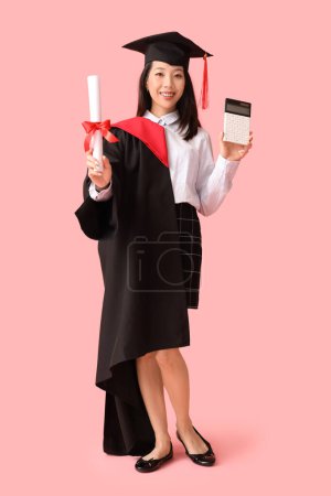 Photo for Asian female graduate student with diploma and calculator on pink background - Royalty Free Image