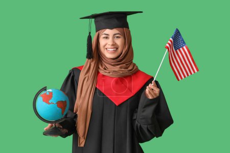 Photo for Muslim female graduate student with USA flag and globe on green background - Royalty Free Image