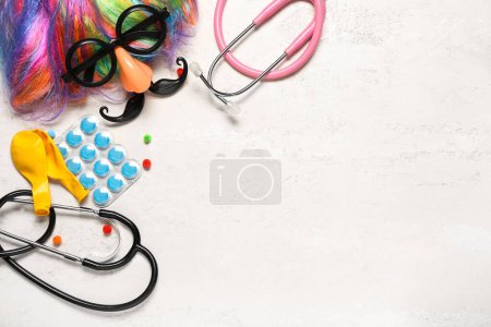Photo for Composition with pills, medical supplies and party decor on light background. April Fool's Day celebration - Royalty Free Image