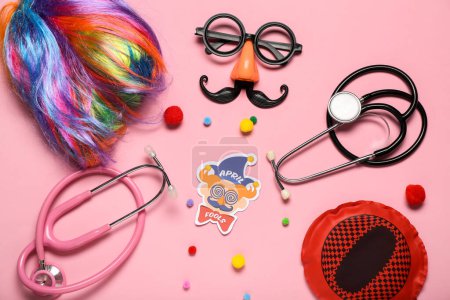 Photo for Composition with stethoscopes and party decor on pink background. April Fools Day - Royalty Free Image