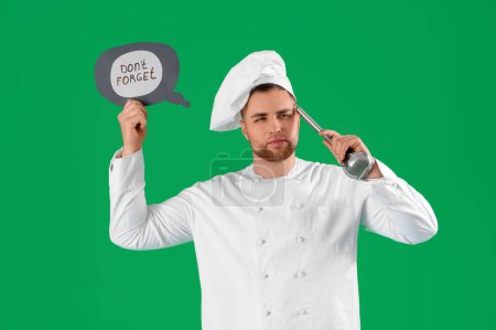 Thoughtful chef holding paper with text DON'T FORGET and ladle on green background