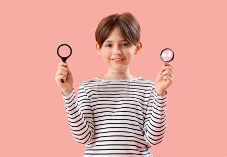 Photo for Little boy with magnifiers on pink background - Royalty Free Image
