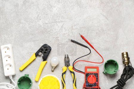 Photo for Set of electrician equipment on white grunge background - Royalty Free Image