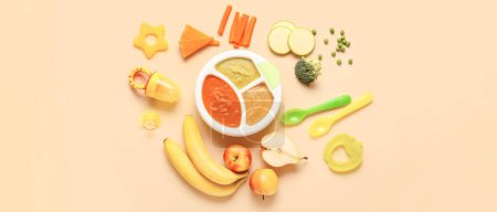 Healthy baby food on beige background