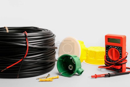 Photo for Set of different electrician's supplies on color background - Royalty Free Image