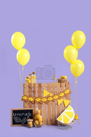 Lemonade stand with chalkboard and balloons on lilac background