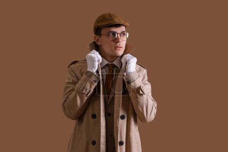 Male spy on brown background