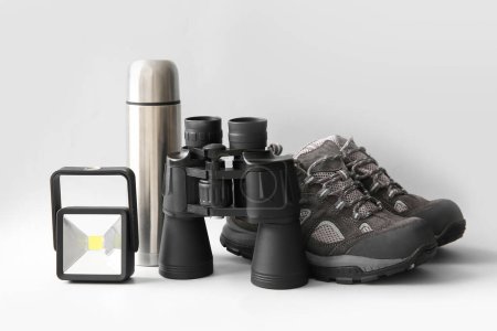 Photo for Composition with binoculars and travel items on white background - Royalty Free Image