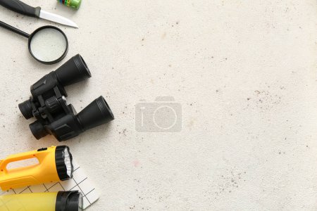 Photo for Binoculars and travel items on light background - Royalty Free Image