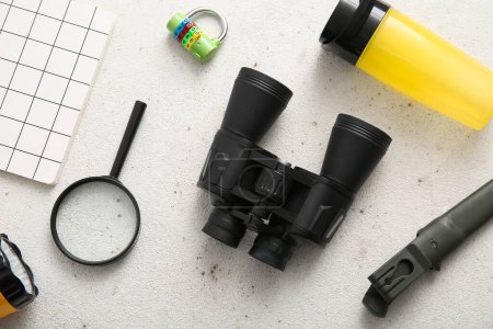 Photo for Binoculars and travel items on light background - Royalty Free Image