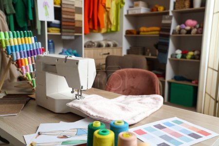 Photo for Tailor's workplace with sewing machine in atelier - Royalty Free Image