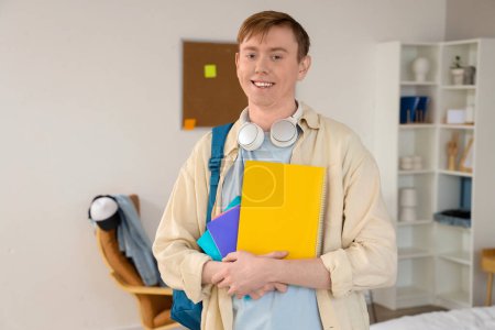 Photo for Male student with copybooks at home - Royalty Free Image