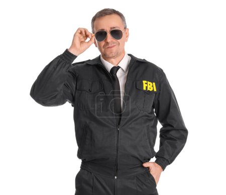 Mature FBI agent in sunglasses on white background