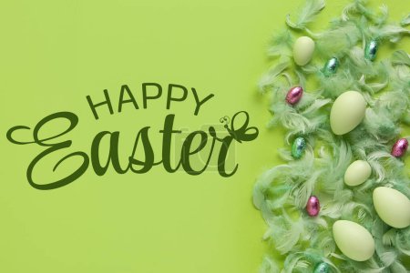Photo for Beautiful Easter greeting card with eggs and feathers on green background - Royalty Free Image