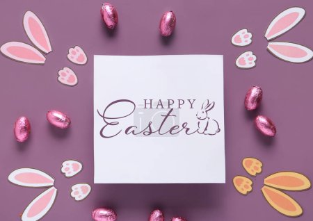 Photo for Easter greeting card, chocolate eggs and bunny ears on color background - Royalty Free Image