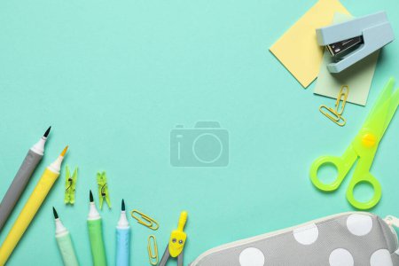 Photo for Set of school supplies on turquoise background. Top view - Royalty Free Image