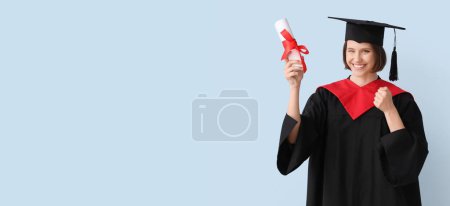 Photo for Happy female graduating student holding diploma on light blue background with space for text - Royalty Free Image