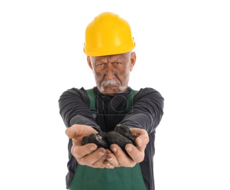 Mature miner man with coal on white background