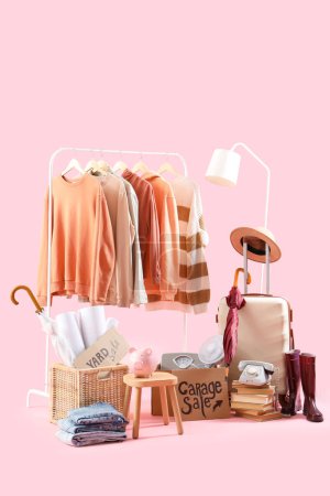 Photo for Unwanted stuff for garage sale on pink background - Royalty Free Image