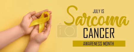 Photo for Hands with yellow ribbon on color background. Banner for Sarcoma Cancer Awareness Month - Royalty Free Image
