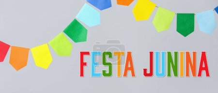 Garlands and text FESTA JUNINA (June Festival) on grey background