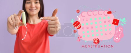 Photo for Young woman with tampon and drawn menstrual calendar on lilac background - Royalty Free Image