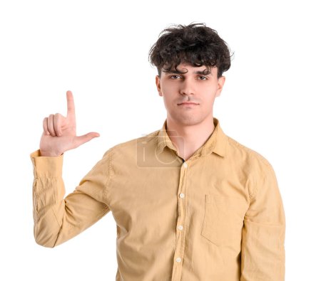 Photo for Young man showing loser gesture on white background - Royalty Free Image